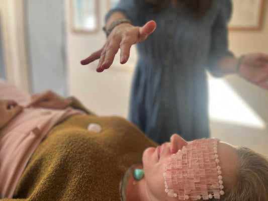 healers hand over client during healing session