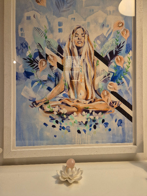 image of painting of a cross legged woman with a rose quartz on a lotus flower holder in the foreground