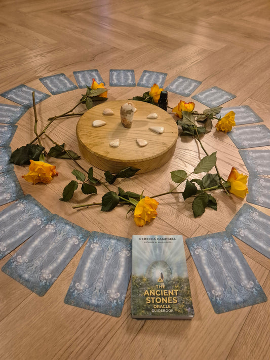 Scolecite crystal circle. Altar layout with oracle cards crystals and yellow roses